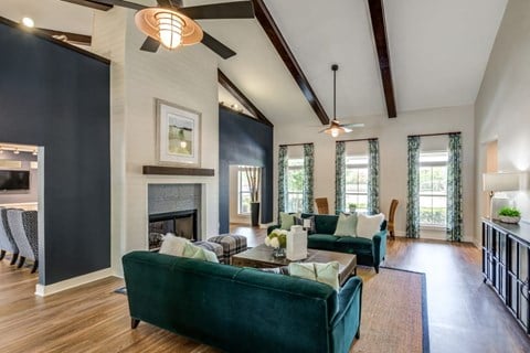 a living room with couches and a fireplace